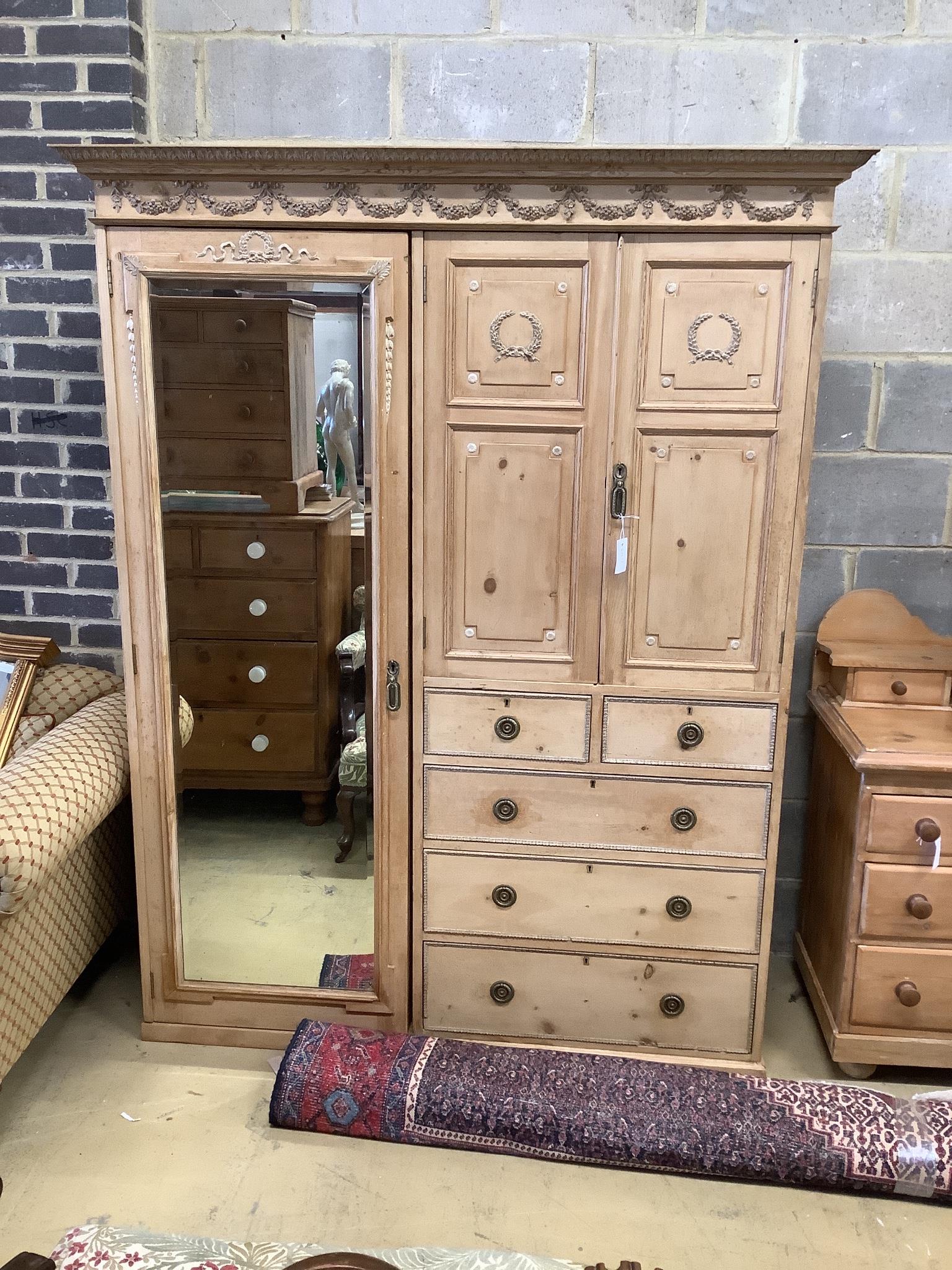 An Edwardian pine compactum wardrobe retailed by Maple & Co., length 113cm, depth 60cm, height 196cm